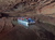 Group of Indiana Cave visitors standing by waterfall