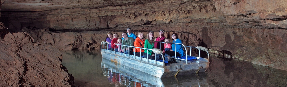 cave tour group on boat