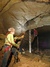 employee belaying exploring as they enter or exit the cave