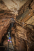 Group of Indiana Cave visitors standing by waterfall